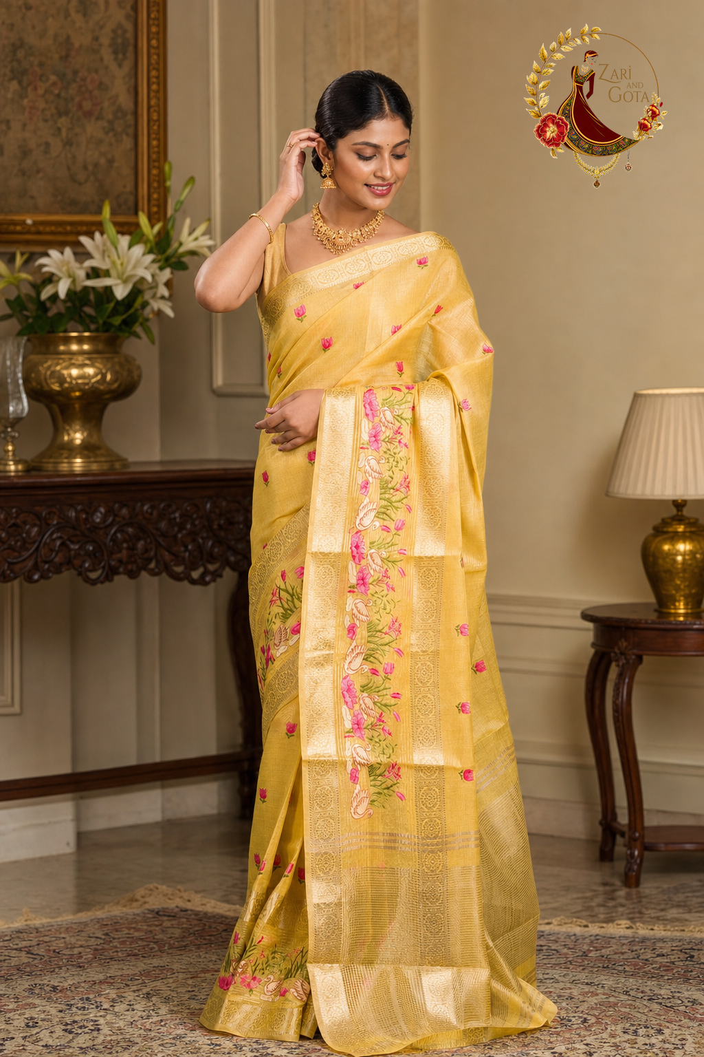 Side view of the golden yellow saree showing the embroidered pallu band