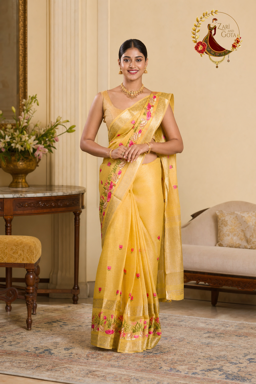 Front view of the golden yellow tissue cotton saree with scattered pink buds