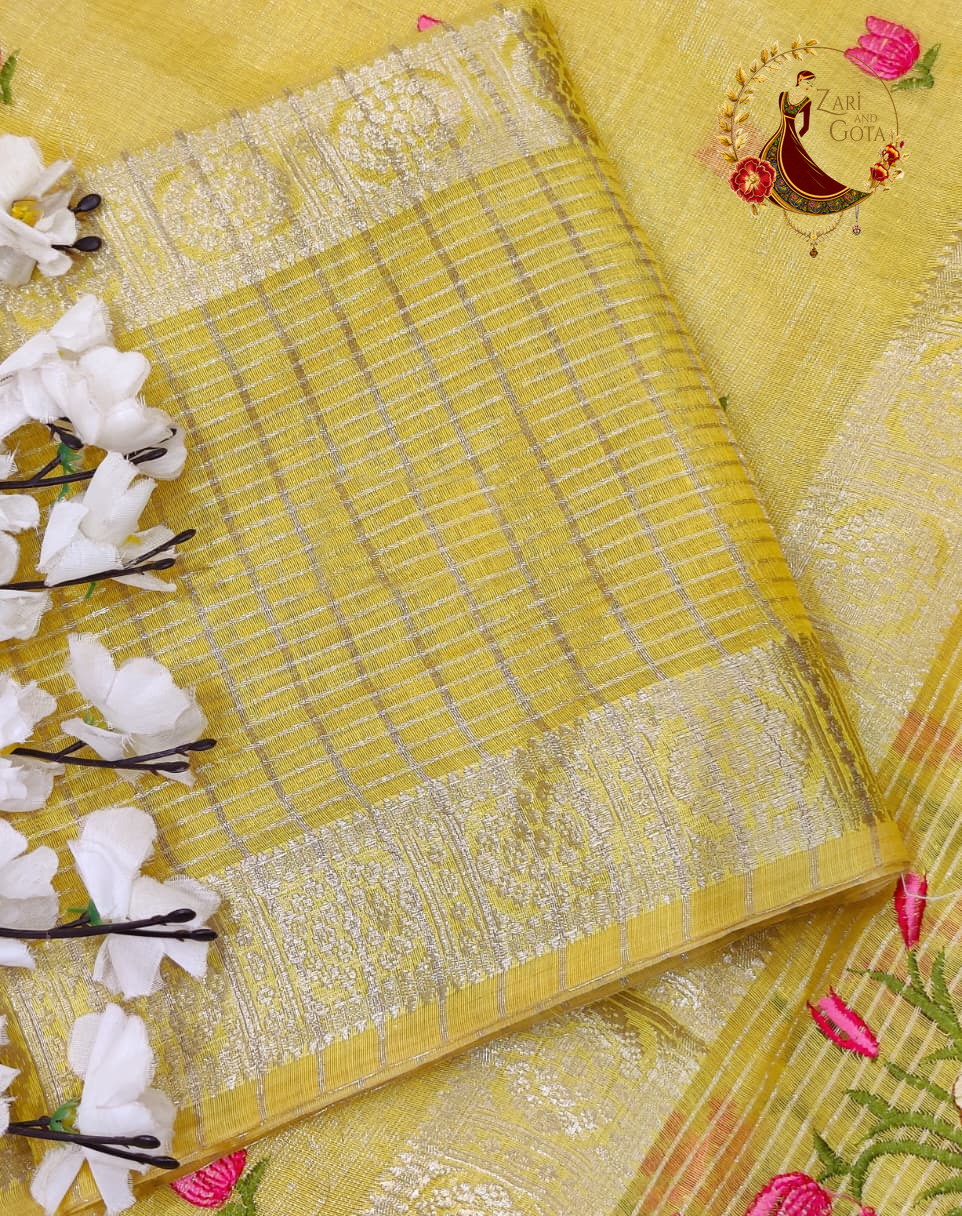 Golden yellow checked blouse piece supplied with the saree