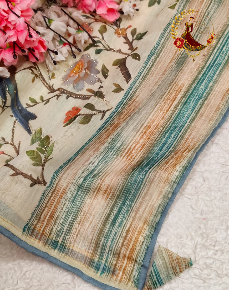 Striped teal and rust woven pallu of the cream cotton silk saree