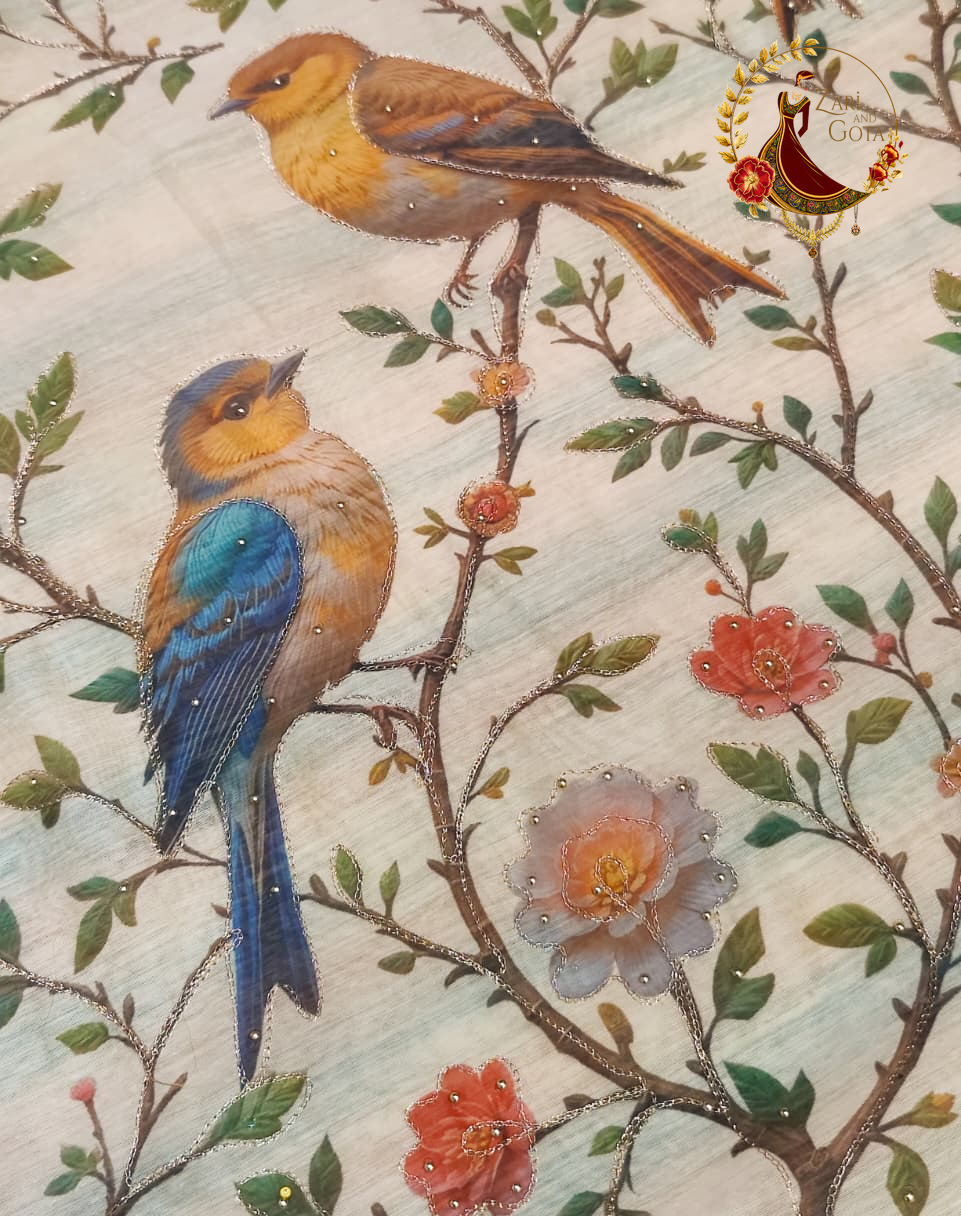 Close detail of printed blue and russet songbirds on a flowering branch