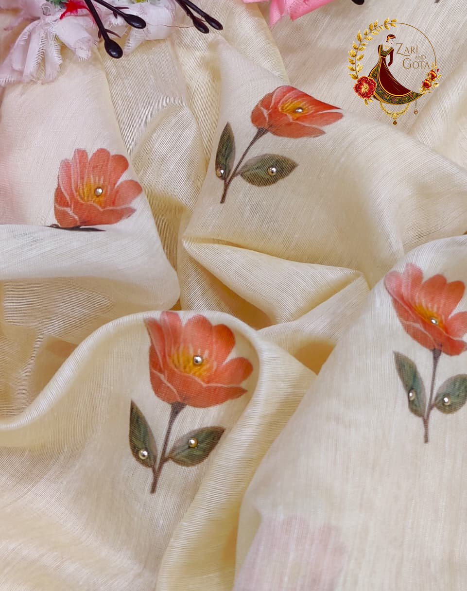Coral stone-set blooms scattered across the cream cotton silk ground