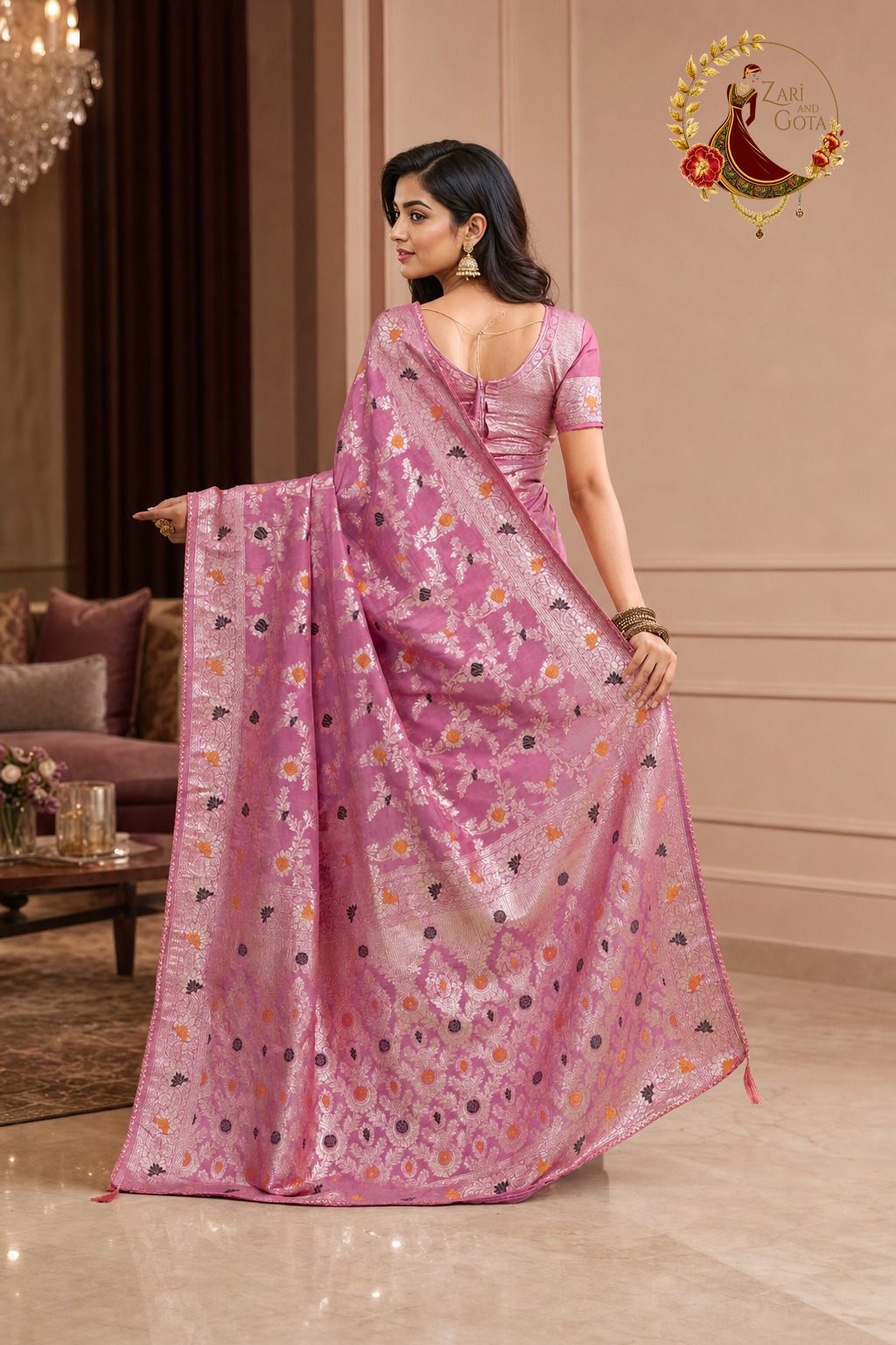 Back view of the rose pink saree with the pallu spread to show the vine weave