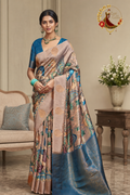 Blush and teal tissue silk saree with kalamkari-style figurative print, worn by a model