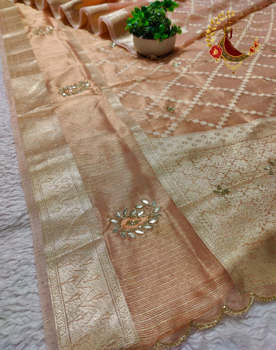 Scalloped gold zari edging and cutdana motifs along the border